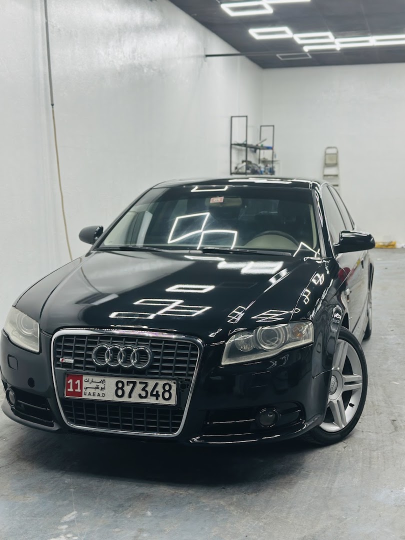A black Audi with a corrected finish