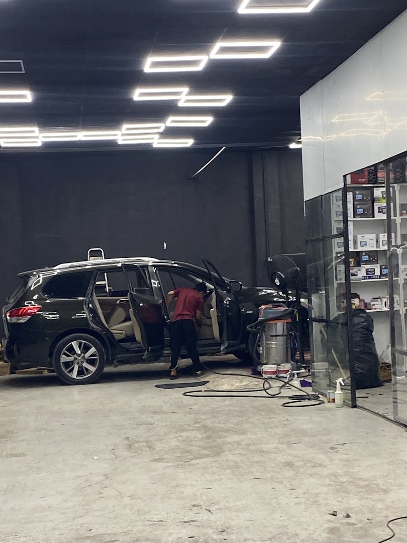 The team working on a vehicle in the Musaffah unit