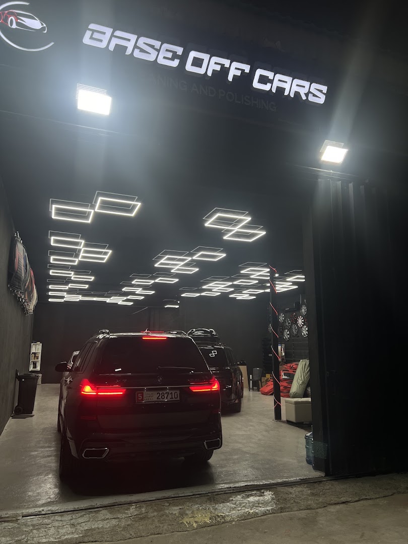 The workshop floor with a car under the lights